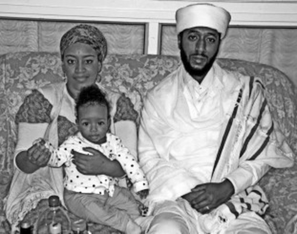 Qes Efraim Zion-Lawi with his wife Fasika and their daughter  /Shai Afsai